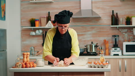 woman take dough out of the bowl