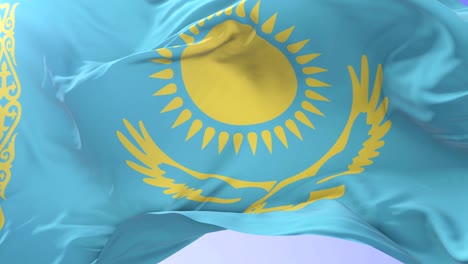 bandera de kazajstán ondeando en el viento con el cielo azul en lento, bucle