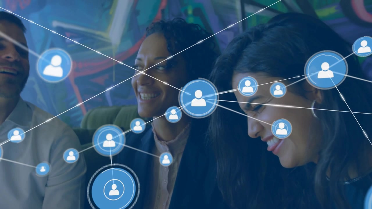 Team of three chatting on sofa, node emerging over group, blue nodes linking business network