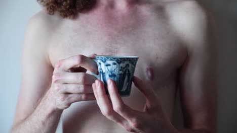 transgender man showing surgery scars on chest