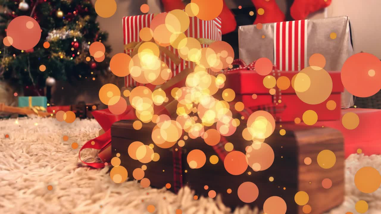 Subtle zoom focusing on wrapped Christmas gifts as golden sparkles swirling to evoke holiday magic