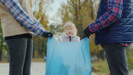 Portrait-Of-A-Volunteer-Child-Collecting-Trash-In-A-Park