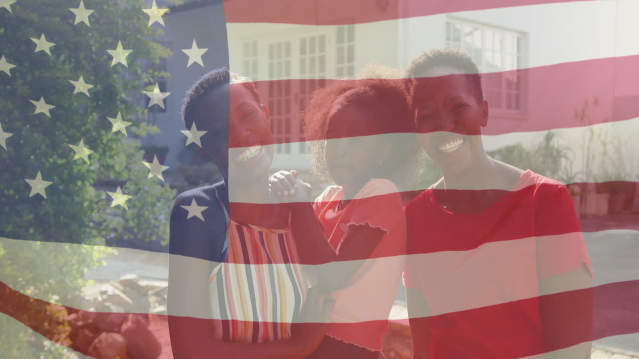 animación de la bandera de los ee.uu. sobre feliz abuela afroamericana, madre e hija