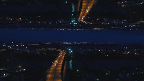 night city aerial view with highway reflection