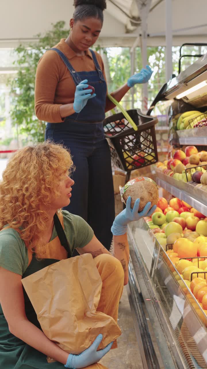 Customers shopping for fruit at a grocery store