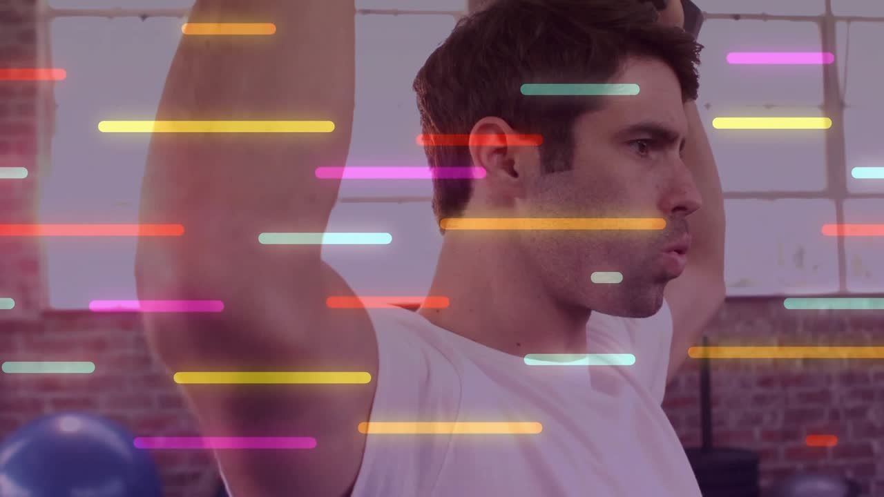 Man starting overhead press by lifting dumbbells, building strength, neon bars sweeping in front