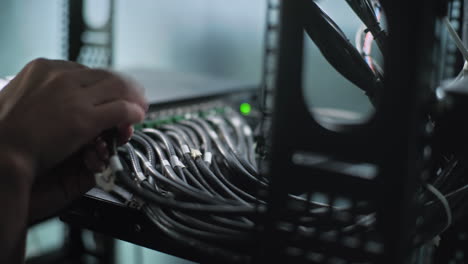 network technician working on server cables