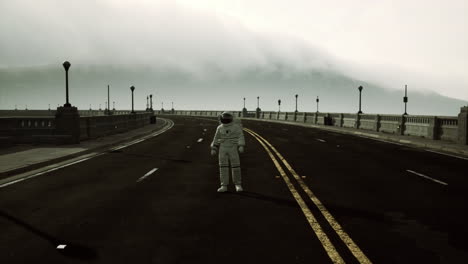 astronaut walks in the middle of a road