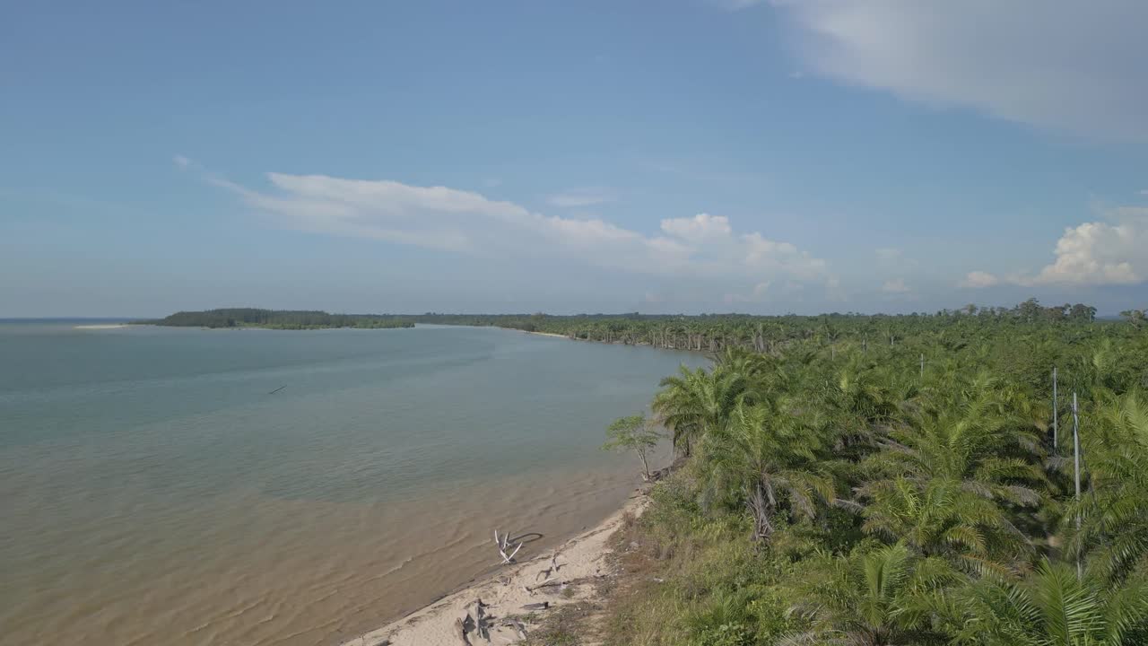 Aerial Drone View During Summer Alit Fishing Village,Kabong With, Facing Open Blue Sea, White Sandy Beach,Green Coconut, Palm Trees,And River,Sarawak,Borneo