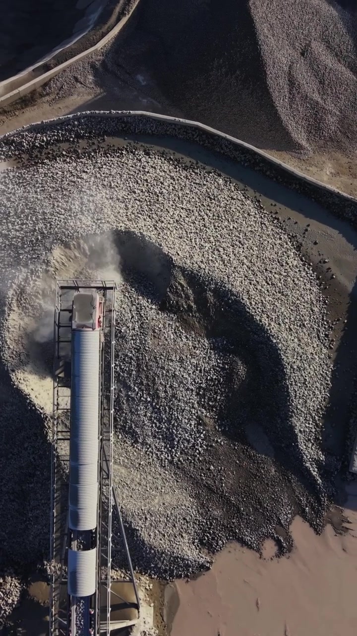 Quarry operations and machinery seen from above during daylight