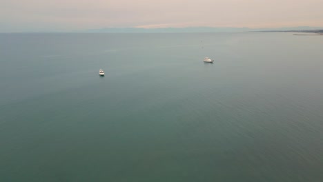 yachting on the serene sea near side resort town, turkey