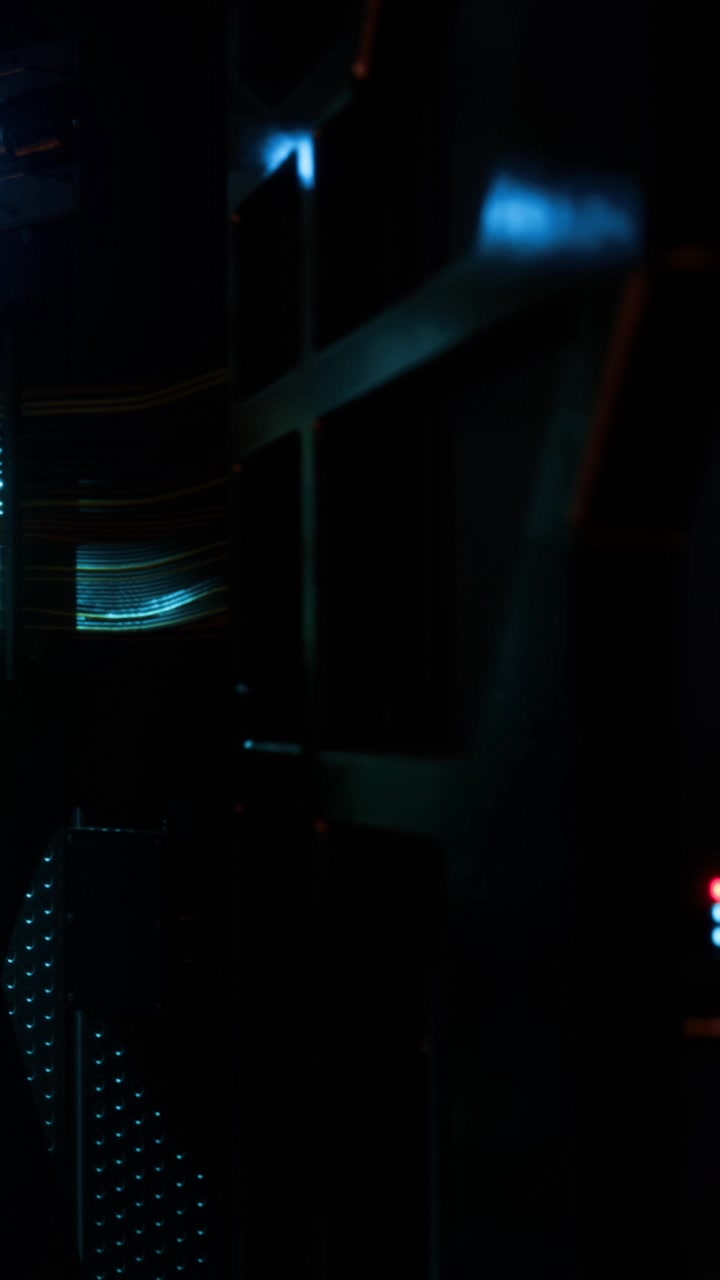 Light reflections and shadows create patterns in a dark room at night