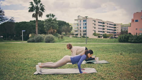 strong athletes doing burpees workout glade. women having cardio core exercise