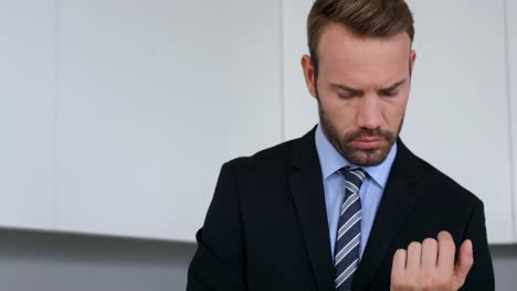 businessman adjusting his cuff