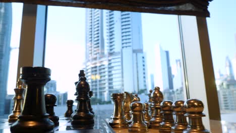 chess game with a view of dubai skyscrapers
