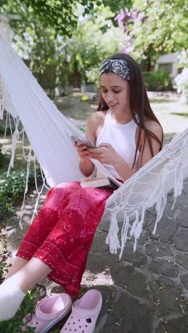 young woman relaxing in a hammock