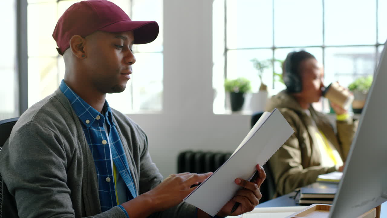 Digital agency, writing and notebook with employee