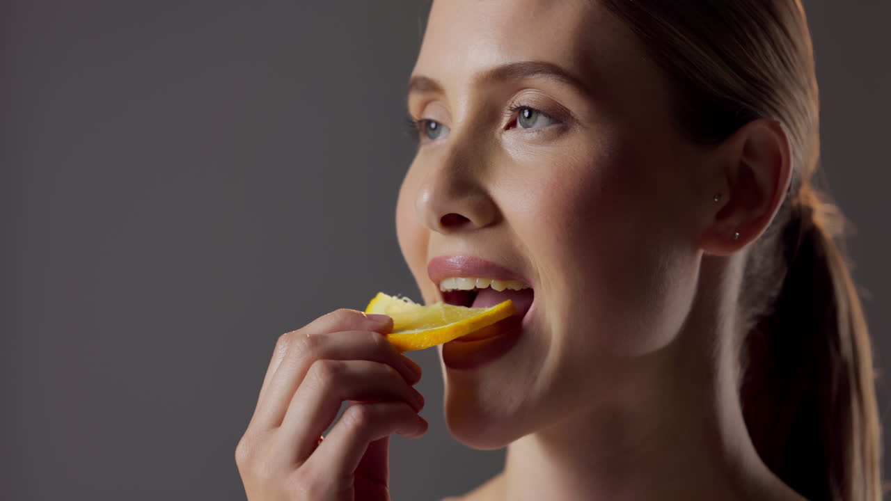 Woman with lemon slice