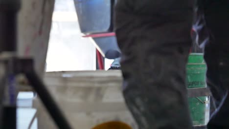 Worker-pours-water-into-a-bucket