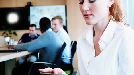 female executive using digital tablet