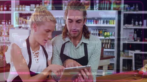 animation of computer language over caucasian coworkers using digital tablet in cafe