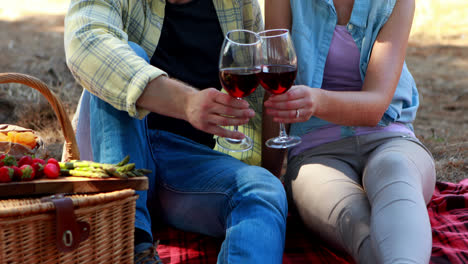 couple having wine in olive farm 4k