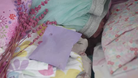 girl's clothes and accessories in a pile