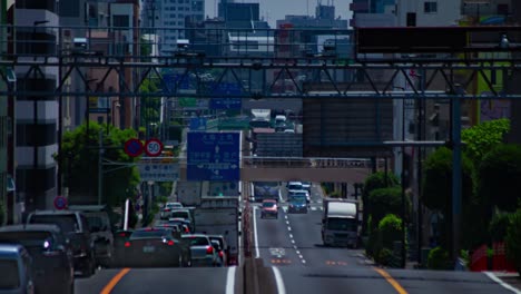 a timelapse of the traffic jam at the urban street in tokyo long shot