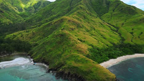 flying above above the mountain range at anawangin cove, san antonio, zambales, philippines