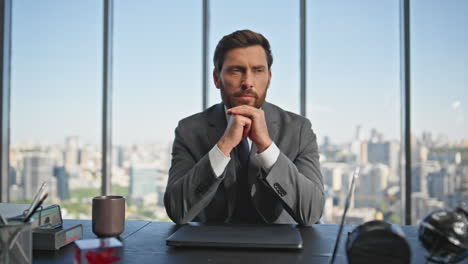 mature businessman thinking ideas at cityscape view. worried man working office