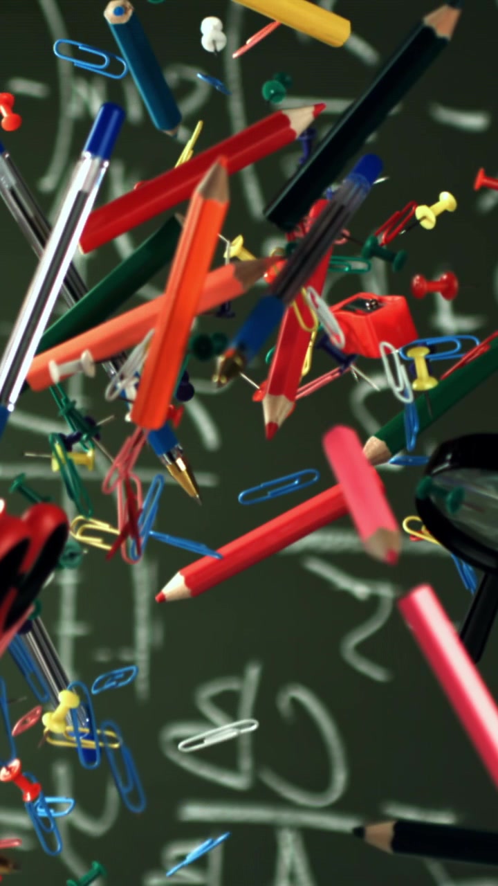 Colorful Stationery and School Supplies Floating Against a Math Chalkboard