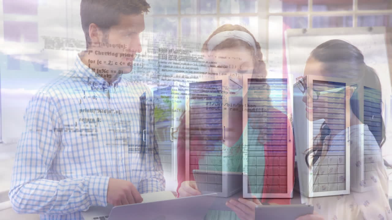 IT team collaborating around laptops, displaying code overlay and flipchart visuals in tech hub