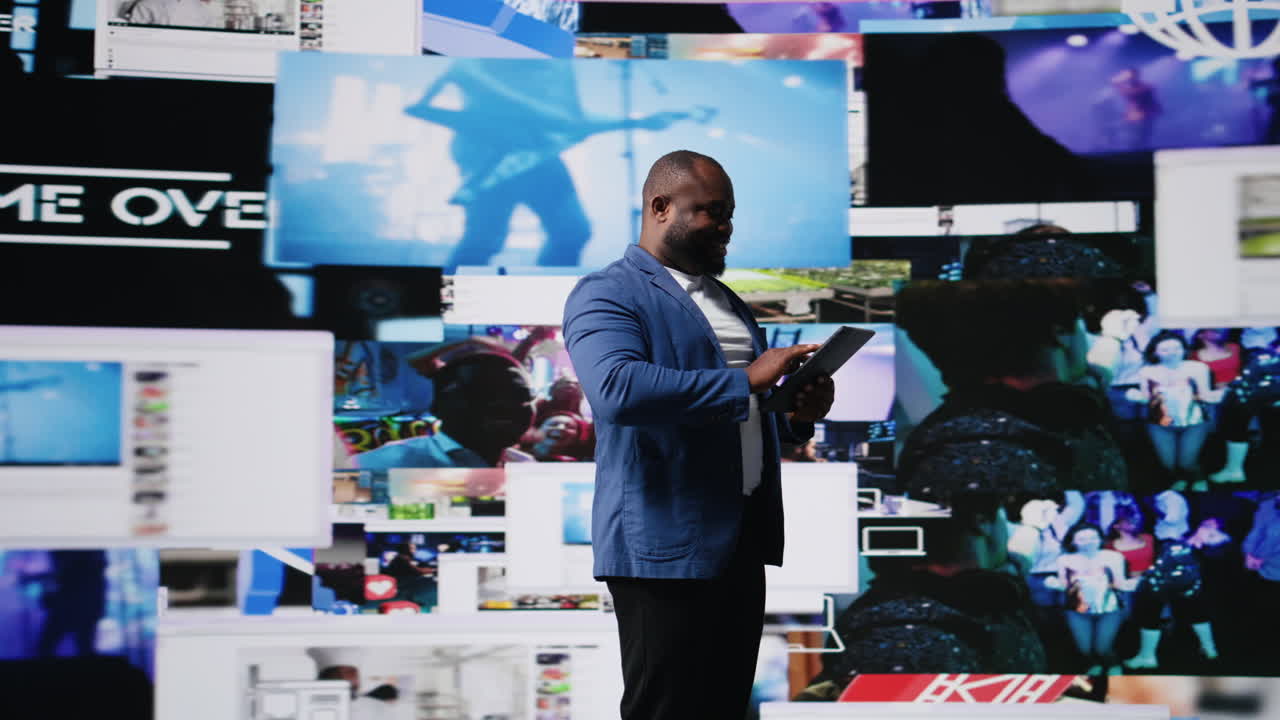 African american digital creator interacting with high tech visuals and screens