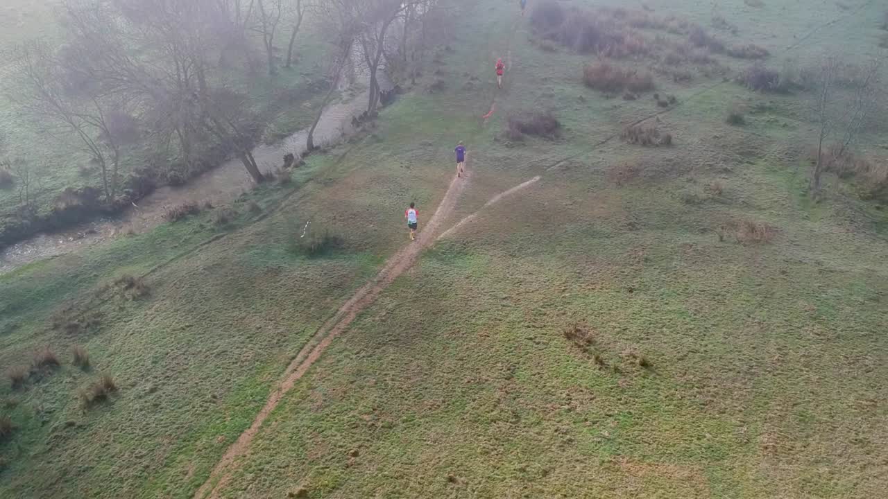 Cross Country Runners in a Misty Morning