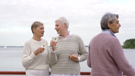 three senior women toasting 1