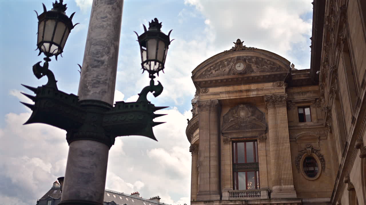 Street lamp standing in front of the Palais Garnier in Paris, France