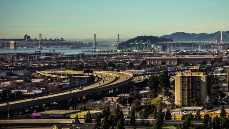 San-Francisco-city-vehicle-traffic-with-the-Golden-Gate-Bridge-over-the-Bay-in-the-background---time-lapse