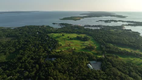 drone shot of a golf course nestled in the cape cod landscape