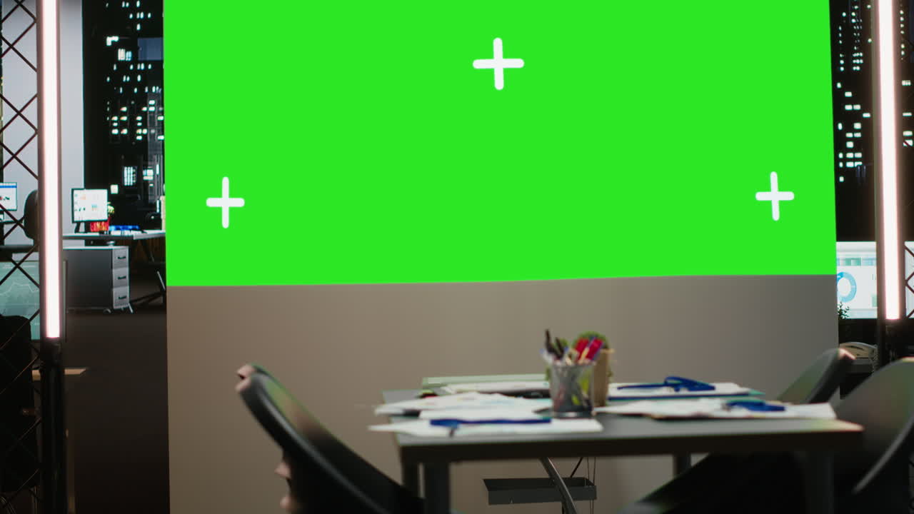 Empty boardroom with a digital copy space projection for a late night session