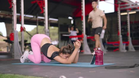 woman stretching in outdoor gym