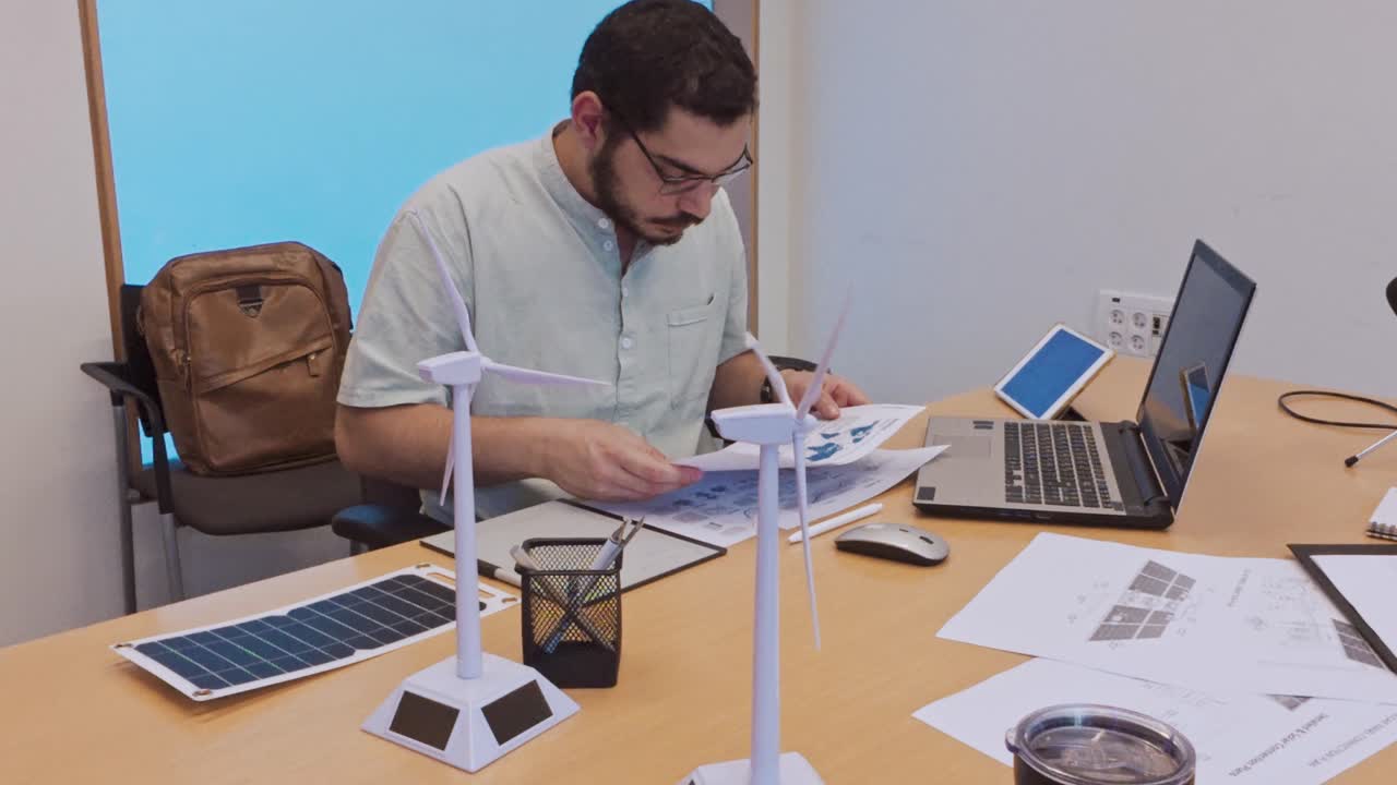 Young Professional Organizing Documents for a Green Energy Project