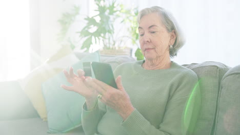 Senior-woman,-credit-card-and-phone-in-home