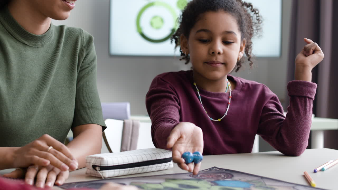 Teacher and Student Playing Board Game