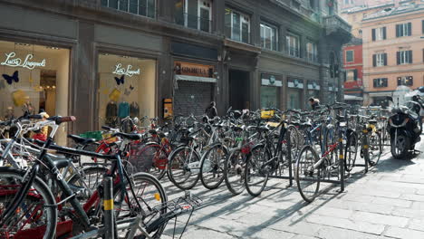 bicycle parking in european city street with shops