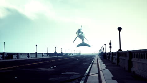 a dolphin leaps over a bridge in a foggy setting.