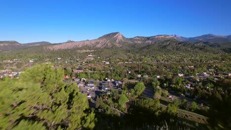 aerial reveal of downtown durango, colorado from fort lewis college