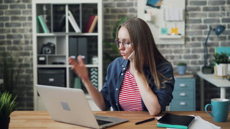 woman on phone call and laptop