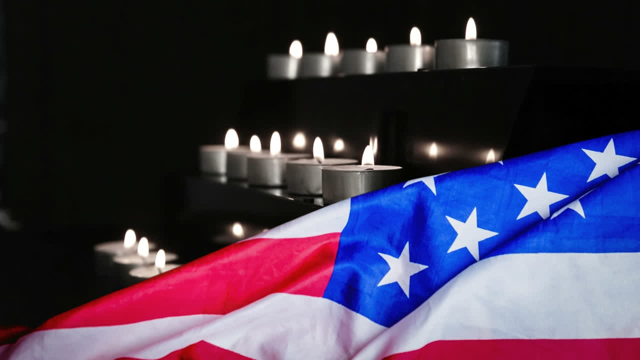 bandera estadounidense y velas soplando