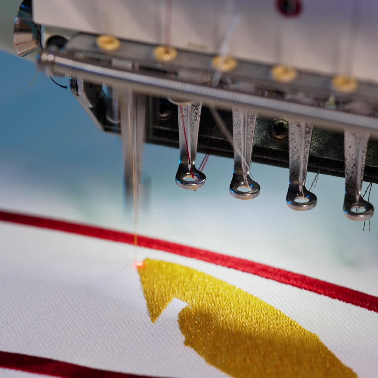 Labor work in garment factory. Close up of automatic machine in textile factory