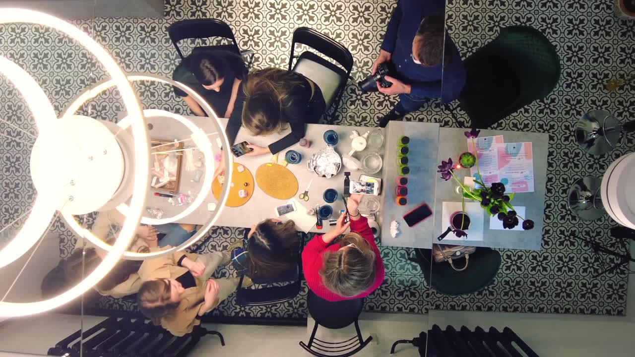 High angle view of people filming a creation atelier